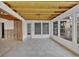 View of room with exposed ceiling beams and door to the outside at 508 65Th St, Holmes Beach, FL 34217