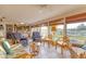 Relaxing sunroom with comfortable seating and plenty of sunlight and canal views at 508 65Th St, Holmes Beach, FL 34217