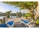 Beautiful waterfront view with a wooden dock and lounge chairs, perfect for enjoying the sunshine and tranquility at 508 65Th St, Holmes Beach, FL 34217