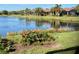 Scenic lake view with lush landscaping and wildlife at 8251 Varenna Dr, Sarasota, FL 34231