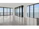 Bright living room with floor to ceiling windows and stunning water views at 2912 W Santiago St # 2004, Tampa, FL 33629