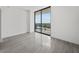 Modern bedroom with floor to ceiling windows and city views at 2912 W Santiago St # 2004, Tampa, FL 33629