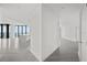 Bright hallway with gray tile floors and access to multiple rooms at 2912 W Santiago St # 2004, Tampa, FL 33629