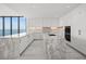 Modern kitchen with marble island and water views at 2912 W Santiago St # 2004, Tampa, FL 33629