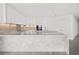 Modern kitchen with white shaker cabinets and marble countertops at 2912 W Santiago St # 2004, Tampa, FL 33629