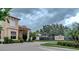 Gated community entrance with landscaping and signage at 4271 Cascade Falls Dr, Sarasota, FL 34243