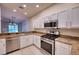 Kitchen with stainless steel appliances and granite countertops at 4271 Cascade Falls Dr, Sarasota, FL 34243