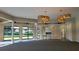 Bright community room with large windows and modern chandeliers at 4271 Cascade Falls Dr, Sarasota, FL 34243