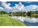 Serene lake with lush landscaping and beautiful reflections at 4271 Cascade Falls Dr, Sarasota, FL 34243