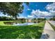 Beautiful lakefront community with lush landscaping at 4271 Cascade Falls Dr, Sarasota, FL 34243