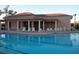 Community pool with adjacent cabana and lounge chairs at 4271 Cascade Falls Dr, Sarasota, FL 34243