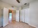 Well-lit bedroom with double doors and large closet at 4271 Cascade Falls Dr, Sarasota, FL 34243