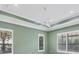 Bright bedroom with plantation shutters and a ceiling fan at 14215 Kinglet Ter, Lakewood Ranch, FL 34202