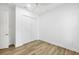 Simple bedroom with wood floors and double door closet at 14215 Kinglet Ter, Lakewood Ranch, FL 34202