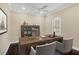 Home office with built-in shelving, hardwood floors, and large window at 14215 Kinglet Ter, Lakewood Ranch, FL 34202
