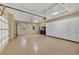 Spacious garage with epoxy flooring and overhead storage at 14215 Kinglet Ter, Lakewood Ranch, FL 34202