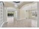 Elegant dining room with arched entryways and tiled floors at 14215 Kinglet Ter, Lakewood Ranch, FL 34202