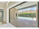 View of the refreshing pool from the interior sliding doors at 14215 Kinglet Ter, Lakewood Ranch, FL 34202