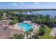 Community pool and clubhouse with lake view at 14215 Kinglet Ter, Lakewood Ranch, FL 34202