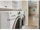 Laundry room with washer, dryer, and garage access at 14215 Kinglet Ter, Lakewood Ranch, FL 34202