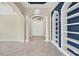 Elegant entryway with built-in shelving and double doors at 14215 Kinglet Ter, Lakewood Ranch, FL 34202