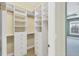 Large walk-in closet with ample shelving and drawers at 14215 Kinglet Ter, Lakewood Ranch, FL 34202