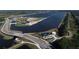 Aerial view of a lake with a surrounding road and park at 14215 Kinglet Ter, Lakewood Ranch, FL 34202