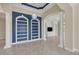 Spacious living room with built-in shelving and a view to the backyard at 14215 Kinglet Ter, Lakewood Ranch, FL 34202