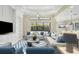 Bright living room featuring comfortable seating and large sliding glass doors at 14215 Kinglet Ter, Lakewood Ranch, FL 34202