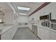 Modern community kitchen with stainless steel appliances at 684 Bird Bay W Dr # 132, Venice, FL 34285