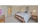 Cozy bedroom with a double bed, ensuite bathroom access, and ample natural light at 684 Bird Bay W Dr # 132, Venice, FL 34285