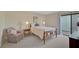 Cozy bedroom with a single bed and access to a patio at 684 Bird Bay W Dr # 132, Venice, FL 34285