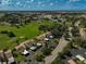 Aerial view showing community layout, green spaces, and parking at 684 Bird Bay W Dr # 132, Venice, FL 34285