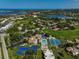Aerial view of community amenities including tennis courts and swimming pool at 684 Bird Bay W Dr # 132, Venice, FL 34285