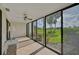 Spacious enclosed patio overlooking a lush green space at 684 Bird Bay W Dr # 132, Venice, FL 34285