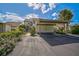 Condo with carport and landscaping, showcasing its exterior at 684 Bird Bay W Dr # 132, Venice, FL 34285