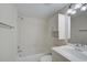 Clean bathroom with a shower/tub combo and white tile at 684 Bird Bay W Dr # 132, Venice, FL 34285