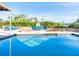 Relaxing pool with patio furniture and outdoor fireplace at 815 Tropical Cir, Sarasota, FL 34242