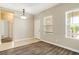 Bright dining area with wood-look floors and a view into kitchen at 11121 Encanto Ter, Bradenton, FL 34211