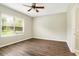 Bright bedroom with hardwood floors and a large window at 11121 Encanto Ter, Bradenton, FL 34211