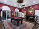 Game room with pool table and access to backyard patio at 815 Tropical Cir, Sarasota, FL 34242