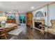 Main bedroom with king-size bed, fireplace, and large windows at 815 Tropical Cir, Sarasota, FL 34242