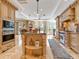 Island kitchen with granite countertops, custom cabinetry, and high-end appliances at 815 Tropical Cir, Sarasota, FL 34242