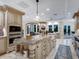 Spacious kitchen with large island, granite counters, and stainless steel appliances at 815 Tropical Cir, Sarasota, FL 34242