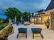 Spacious patio with comfortable lounge chairs and fire pit at 815 Tropical Cir, Sarasota, FL 34242