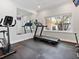 Home gym with a treadmill, exercise bike and large mirror at 815 Tropical Cir, Sarasota, FL 34242