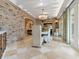 Brick-accent dining room with a rustic table and chairs, and an open feel at 815 Tropical Cir, Sarasota, FL 34242