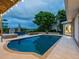 Expansive pool with patio and brick fire pit at 815 Tropical Cir, Sarasota, FL 34242