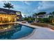 Expansive pool and patio with seating and fire pit area at 815 Tropical Cir, Sarasota, FL 34242