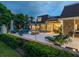 Outdoor patio area with fire pit, lounge chairs and pool at 815 Tropical Cir, Sarasota, FL 34242